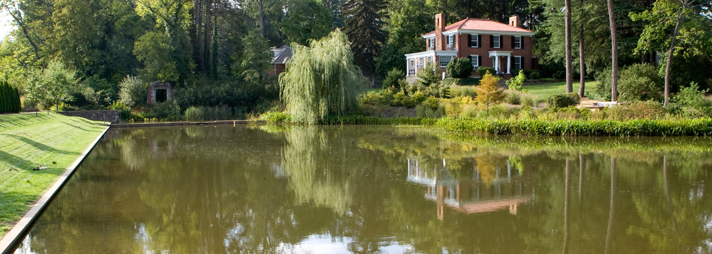 The Dell's pond and the historic home of William Lambeth in the background